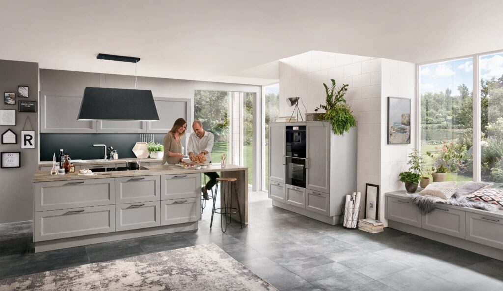Light cascada kitchen from Prestons Kitchens - woman in kitchen